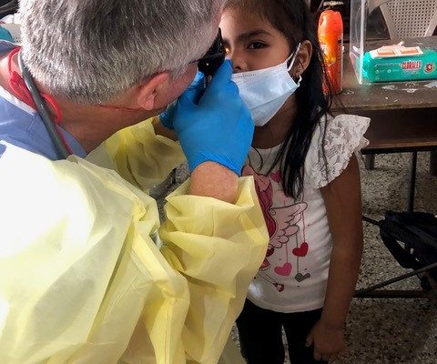Dr. Dimmick, Pediatrician, examines Bea, a four year old girl with Strabismus
