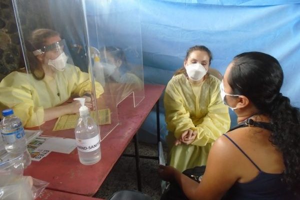 Lauren, Licensed Physician Assistant, General Medicine, interacts with patient through the help of Alejandra, Interpreter