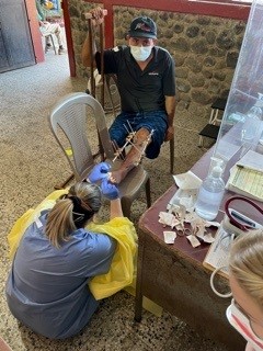 Physician Assistant Shelby with Jorge, a patient who was in a motorcycle accident